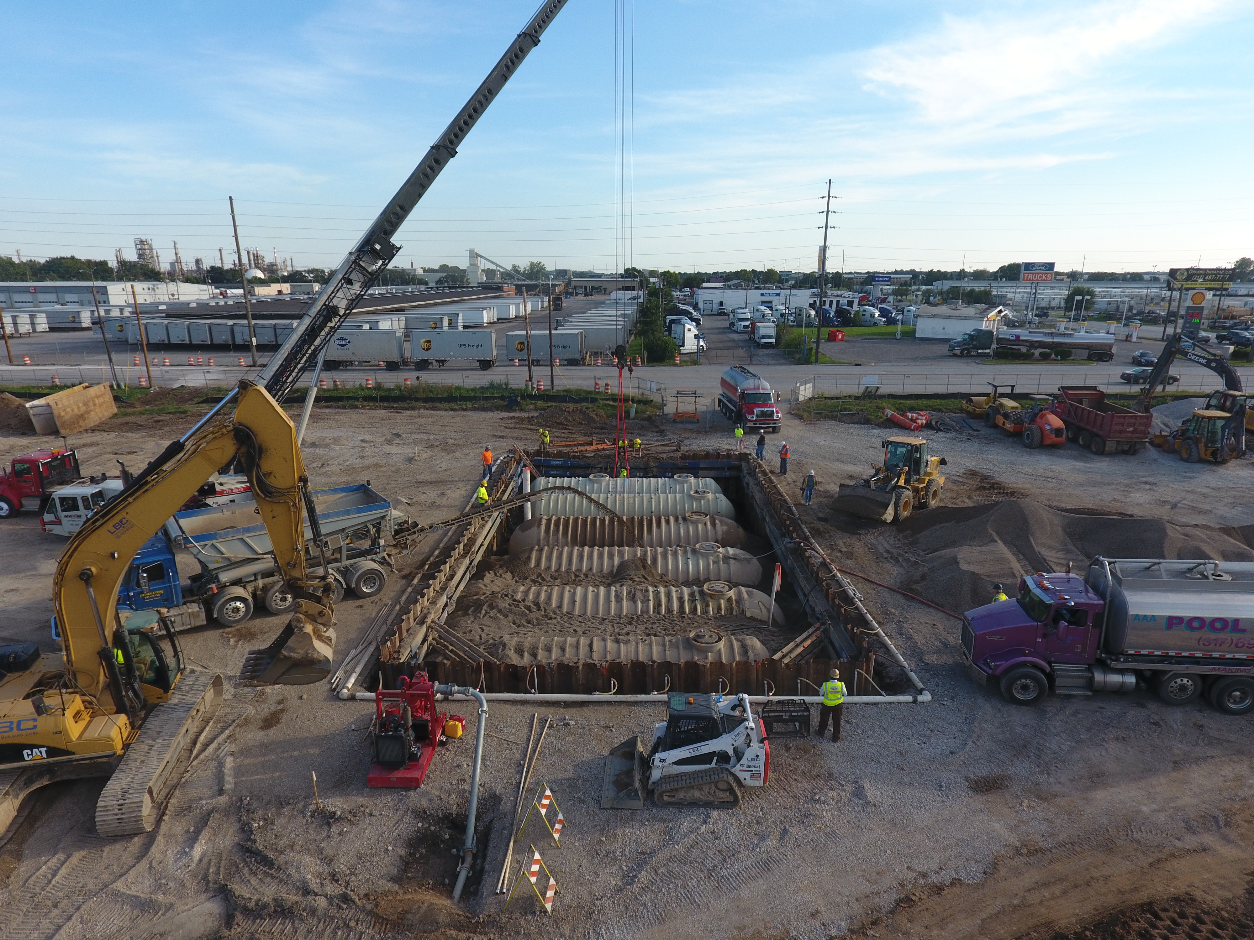 Work site with heavy machineries and workers
